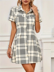 Short sleeve houndstooth shirt dress with waist tie and button-down collar in black and white