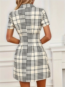 Short sleeve houndstooth mini dress with a slim waistline shown in a back view