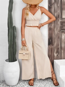 Women's beige summer two-piece set featuring jacquard v-neck camisole and side slit wide leg pants