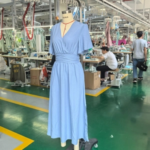 Detailed view of light blue maxi dress featuring ruffled butterfly sleeves and V-neckline