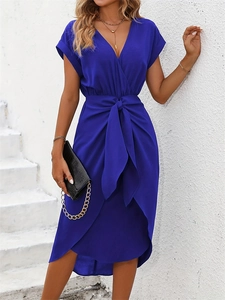 Detail of royal blue V-neck dress featuring short sleeves and a stylish wrap waist tie