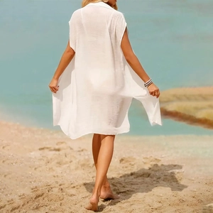 Macro detail of lightweight white semi-transparent beach cover-up with textured fabric