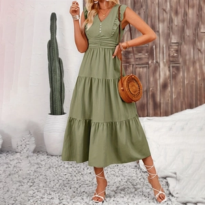 Detail of V-neck sage green tiered dress featuring ruffled sleeves and decorative buttons