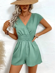 Mint green V-neck romper with vertical stripes and cinched waist for summer wear