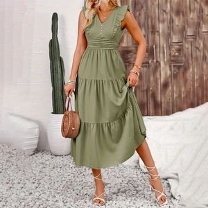 Detail of sage green sleeveless maxi dress with ruffle shoulders and tiered cake skirt