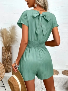 Sage green short sleeve romper with striped texture and back bow tie detail for summer