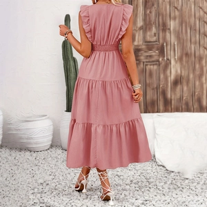 Detail view of pink sleeveless tiered dress back with ruffled sleeves and textured fabric
