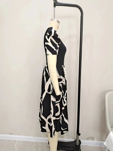 Detail view of the black and white abstract geometric pattern on a slim-fit knit dress