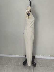 Elegant beige two-piece suit with V-neck vest and high-waist trousers on mannequin