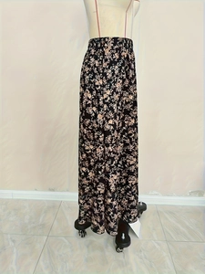 Detail of floral maxi skirt with elastic waistband on a mannequin stand