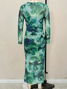Detail view of ruching on slim fit long sleeve tie-dye green floral maxi dress