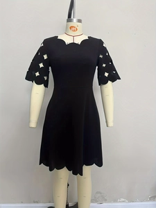 Elegant black short-sleeved dress with scalloped edges and hollowed-out diamond patterns