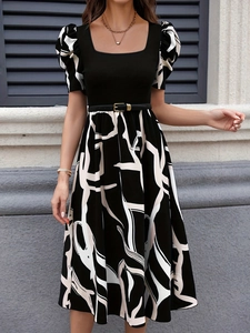 Detail of elegant puff sleeves and chic square neckline on a black knitted midi dress