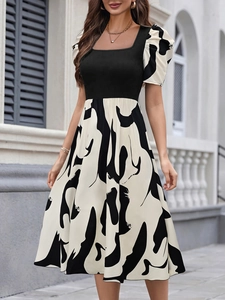 Elegant square neck puff sleeve midi dress with black bodice and abstract print skirt