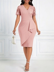 Detail of elegant pink fitted dress showing sequin lace splicing and ruffle hem texture