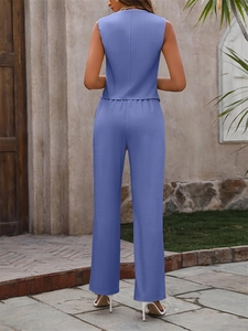 Rear view of woman in sleeveless blue-purple vest and high waist straight trousers set