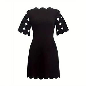 Detailed view of black short-sleeve A-line dress with scalloped edges and cutout patterns