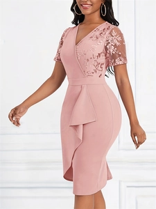 Detail of pink slim dress featuring exquisite lace embroidery and ruffled mesh accents