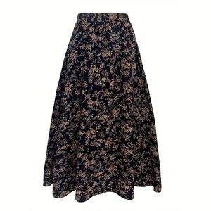 Close-up of vintage floral pattern on black A-line pleated skirt with elastic waist