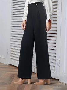 Elegant high-waisted black wide-leg trousers with gold buttons and pleated detail