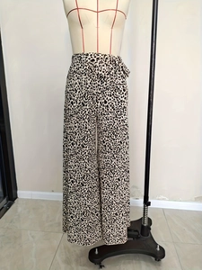 Women high waist leopard print wide leg pants with matching bow belt and flare fit