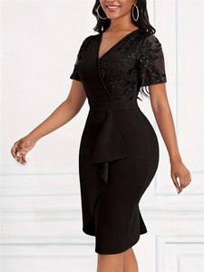 Detail of elegant V-neck dress with lace stitching and asymmetrical ruffle waist design