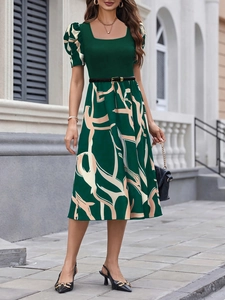 Detail of square neck and puff sleeves on a dark green slim fit knit printed dress