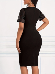 Detailed view of the delicate black lace embroidery on the elegant slim fit dress sleeve