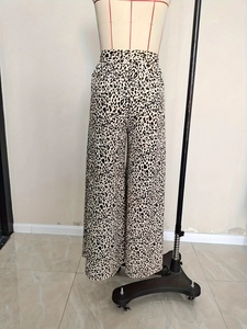 Women's leopard print high waist flare trousers with elastic waistband and wide leg design