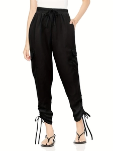 Detail view of adjustable drawstring cuffs on black cargo joggers for women