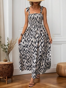 Bohemian ikat print smocked maxi dress with bow straps for summer vacation style