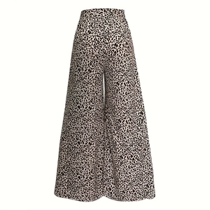 Detail view of high-waist leopard print flare trousers with a breathable fabric texture