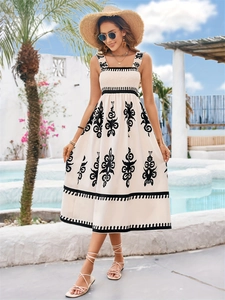 Detailed embroidery and square neck strap design on a cream bohemian vacation maxi dress
