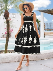 Elegant black printed sundress with wide straps and floral motifs for summer beach vacation