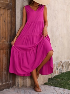 Detail of fuchsia tiered maxi dress with V-neck sleeveless design and layered hem