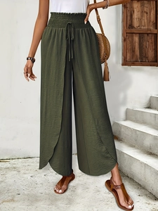 Detail of high waist wide leg pants with textured crinkle fabric and tulip hemline