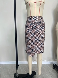 High-waisted pencil skirt with red and blue houndstooth pattern and front knot detail