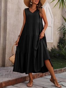 Detail of elegant black sleeveless tiered summer maxi dress with layered ruffle hem style