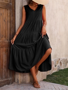 Detailed close-up of a black V-neck sleeveless maxi dress with elegant tiered skirt layers