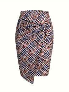 Close-up of houndstooth print midi skirt with front knot detail and asymmetric hemline