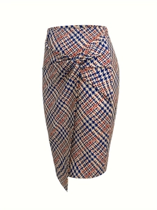 Detail of twisted knot waist and houndstooth pattern on elegant midi skirt
