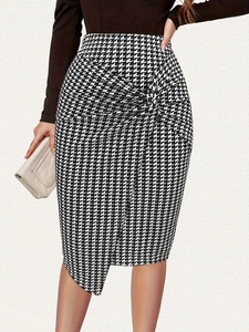 Close-up detail of elegant houndstooth pencil skirt featuring stylish front twist knot