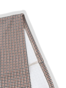Detailed macro view of the houndstooth fabric texture and high-quality overlock stitching