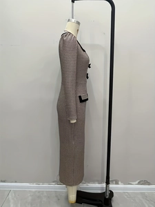 Detail view of the fine plaid texture and elegant black bow decoration on the slim knit dress