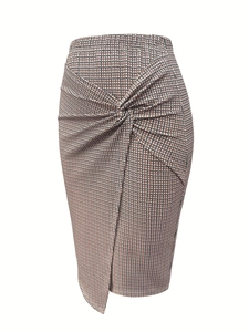 Close-up of elegant high-waisted pencil skirt with front knot detail and houndstooth pattern
