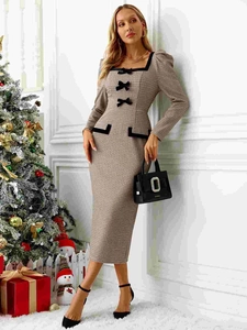 Detail of square neckline with black bows and houndstooth texture on a French dress