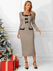 French-style slim-fit plaid knit dress with bow accents in a festive setting