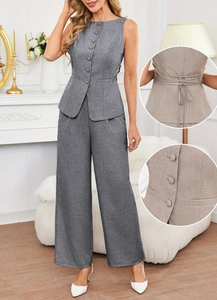 Detailed close-up of grey linen vest buttons and adjustable back tie on women's set