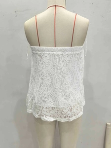 Back view of women's white floral lace camisole top with delicate crochet detailing