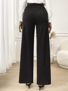 Rear view of elegant black high-waisted wide-leg trousers with flattering straight-cut fit